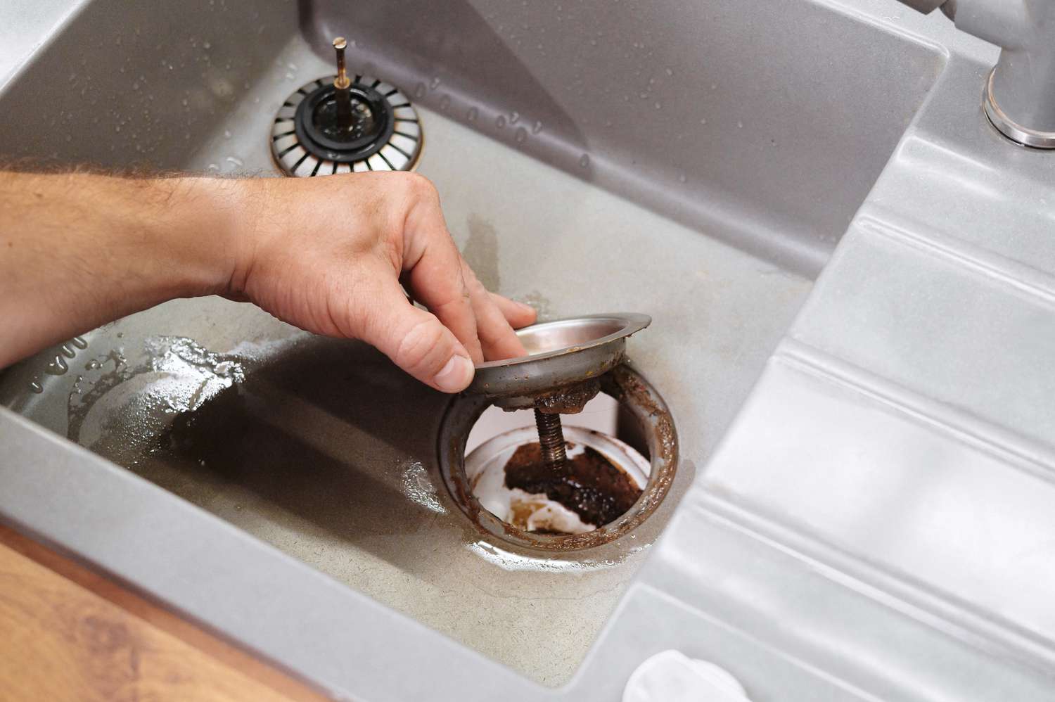 Preparing to Remove the Kitchen Sink Strainer